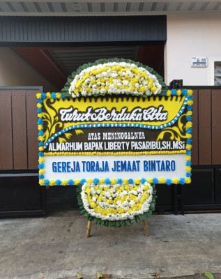 Papan Bunga Duka di Tiomneri